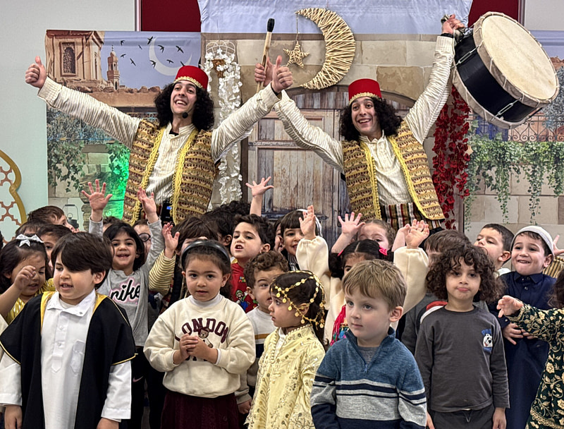 Ramadan Drummers (مسحراتي) Sultan and Hamid smiling with children - children's play - duroub academy, amman.