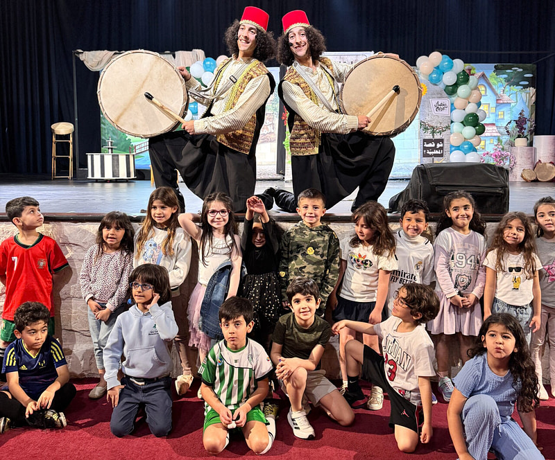 Ramadan Drummers (مسحراتي) Sultan and Hamid on stage with school children for a Ramadan Show - children's entertainment (ترفيه للأطفال)
